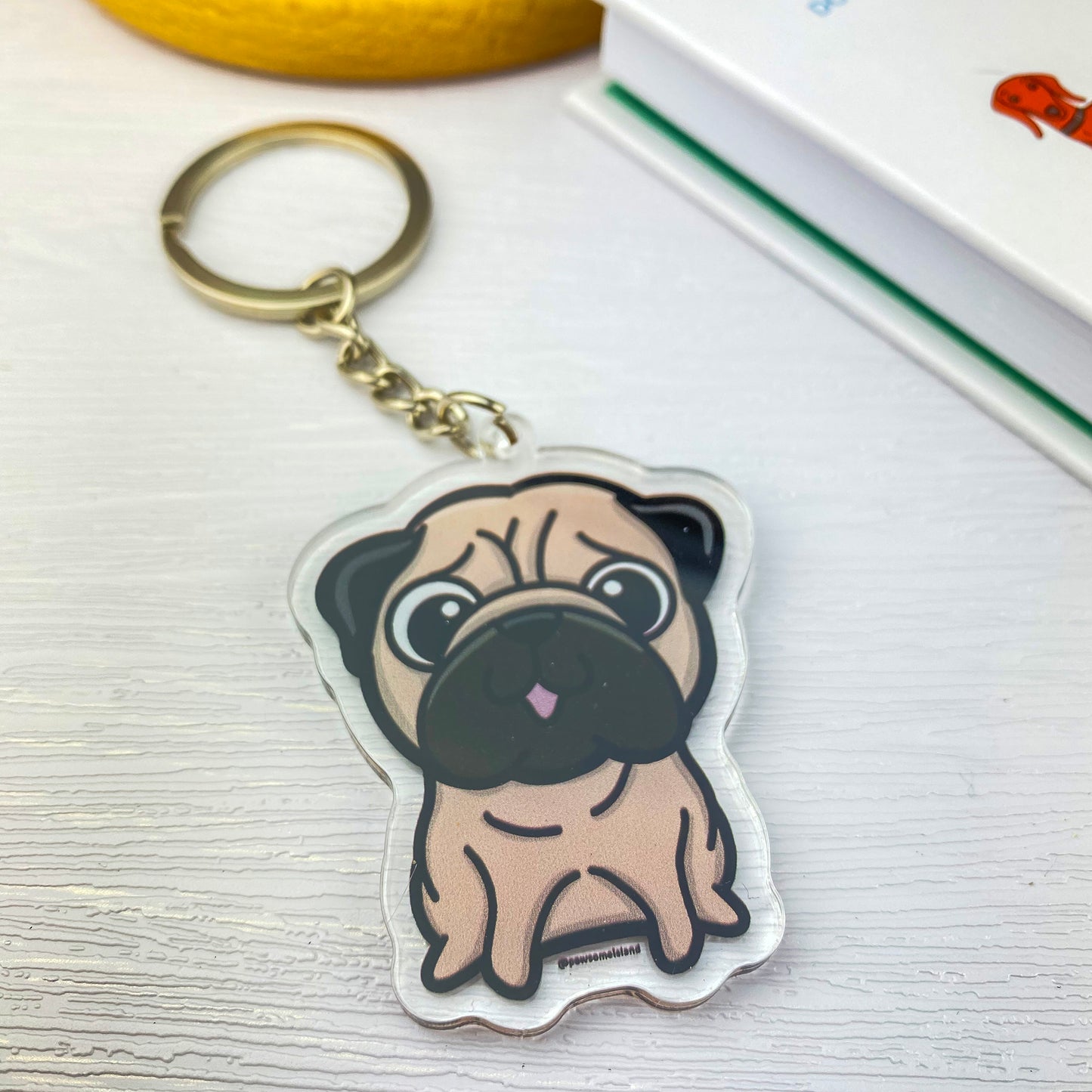 Starling Mike double-sided keychain is seated and fastened to